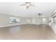 Open living room features tile flooring and large windows providing natural light at 35 Sabal Dr, Punta Gorda, FL 33950