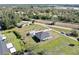 Aerial view of a charming home with a screened lanai and a detached garage at 3714 Gulfbreeze Ln, Punta Gorda, FL 33950