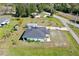 Aerial view of a well-maintained home featuring a new roof and spacious yard in a quiet neighborhood at 3714 Gulfbreeze Ln, Punta Gorda, FL 33950