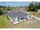 Overhead shot of a cozy home with a detached garage in a tranquil suburban setting at 3714 Gulfbreeze Ln, Punta Gorda, FL 33950