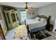 Cozy bedroom featuring a ceiling fan, an area rug and view from the window at 3714 Gulfbreeze Ln, Punta Gorda, FL 33950