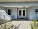 Inviting front porch featuring decorative ironwork, double doors, and tiled flooring at 3714 Gulfbreeze Ln, Punta Gorda, FL 33950