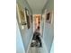 Hallway with a tile floor and doors to other rooms at 3714 Gulfbreeze Ln, Punta Gorda, FL 33950