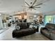 Spacious living room with a large fan and an open floor plan at 3714 Gulfbreeze Ln, Punta Gorda, FL 33950