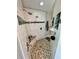 Luxurious walk-in shower with river rock floor, multiple shower heads, and built-in niche at 3714 Gulfbreeze Ln, Punta Gorda, FL 33950