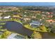 An aerial view showcasing the waterfront home's location within a residential community at 4 Saint Martin Cir, Englewood, FL 34223