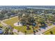 Neighborhood aerial view showcasing a park, mature trees, and a gazebo at 4383 Mckibben Dr, North Port, FL 34287