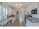 Bright kitchen featuring white cabinets, granite countertops, and a window that provides natural light at 4383 Mckibben Dr, North Port, FL 34287