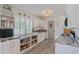 Bright kitchen featuring white cabinets, granite countertops, open storage, and a window for natural light at 4383 Mckibben Dr, North Port, FL 34287