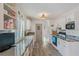 Bright kitchen featuring white cabinets, granite countertops, and a window that provides natural light at 4383 Mckibben Dr, North Port, FL 34287