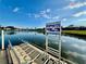 Water access point to the lake and an accessible transfer system with a ladder for easy access to the water at 4383 Mckibben Dr, North Port, FL 34287