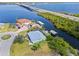 Panoramic aerial perspective displaying the house, waterfront, boat docks, bridge, and vibrant surroundings at 5196 Early Ter, Port Charlotte, FL 33981