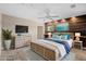 Comfortable bedroom with natural tones and a wooden accent wall at 5196 Early Ter, Port Charlotte, FL 33981