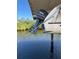 Close-up of a boat lift motor and boat, showcasing functionality for boat maintenance and storage at 5196 Early Ter, Port Charlotte, FL 33981