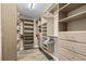 Spacious walk-in closet with custom shelves and drawers at 5196 Early Ter, Port Charlotte, FL 33981