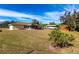 Expansive backyard with boat storage, shed, and lush greenery, great for outdoor activities at 8029 Roy Dr, Punta Gorda, FL 33982