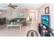 Comfortable living room featuring tile flooring, neutral walls, and views into dining area at 8029 Roy Dr, Punta Gorda, FL 33982