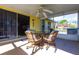 Relaxing screened porch with ceiling fan for pleasant outdoor dining and entertainment at 8029 Roy Dr, Punta Gorda, FL 33982