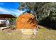 Outdoor wooden storage shed with double doors, adding extra storage space at 8029 Roy Dr, Punta Gorda, FL 33982