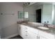 Bathroom features a double vanity with granite countertops and modern fixtures, offering style and functionality at 8226 Olsen St, Port Charlotte, FL 33981