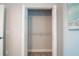 Empty closet featuring bifold doors, carpet and a single shelf at 8403 Placida Rd # 408, Placida, FL 33946