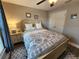 Comfortable bedroom with a large bed and an ensuite bath at 9175 Melody Cir, Port Charlotte, FL 33981