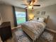 Comfortable bedroom with a queen-sized bed, soft lighting, and tasteful decor at 9175 Melody Cir, Port Charlotte, FL 33981