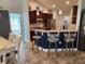 Beautiful kitchen with granite counters, stainless steel appliances, and seating at the island at 9175 Melody Cir, Port Charlotte, FL 33981