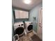 Functional laundry room with modern washer and dryer at 9175 Melody Cir, Port Charlotte, FL 33981