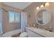 Bathroom featuring a shower-tub combo, and vanity with marble countertop at 92 Circlewood Dr # B3-1, Venice, FL 34293