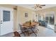 Cozy dining area adjacent to kitchen with tiled floor and view to screened lanai at 92 Circlewood Dr # B3-1, Venice, FL 34293