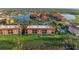 Overhead shot of a community with gorgeous red-roofed buildings and water views, a great place to live at 93 Vivante Blvd # 9336, Punta Gorda, FL 33950