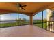 Spacious screened balcony offering stunning waterfront views and a ceiling fan at 93 Vivante Blvd # 9336, Punta Gorda, FL 33950