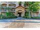 Inviting building entrance with well-manicured landscaping and a charming brick pathway at 93 Vivante Blvd # 9336, Punta Gorda, FL 33950