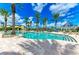 Inviting community pool surrounded by palm trees, perfect for relaxing and enjoying the Florida sunshine at 93 Vivante Blvd # 9336, Punta Gorda, FL 33950