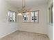 Cozy dining area with chandelier lighting and natural light from large windows at 93 Vivante Blvd # 9336, Punta Gorda, FL 33950