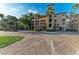 Exterior view of the complex, showcasing its architectural style, landscaping, and accessible parking at 93 Vivante Blvd # 9336, Punta Gorda, FL 33950