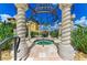 Luxurious hot tub area features decorative columns and a metal dome, surrounded by lush tropical landscaping at 93 Vivante Blvd # 9336, Punta Gorda, FL 33950