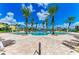 Resort style community swimming pool with lots of lounge chairs and waterfront views at 93 Vivante Blvd # 9336, Punta Gorda, FL 33950