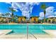 Resort-style swimming pool boasts ample lounge seating, poolside cabanas, and clear blue water for relaxation at 93 Vivante Blvd # 9336, Punta Gorda, FL 33950