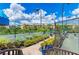 Community tennis courts offer a great recreational space with views of surrounding landscaping and buildings at 93 Vivante Blvd # 9336, Punta Gorda, FL 33950