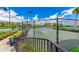 Community tennis courts offer a great recreational space with views of surrounding landscaping and buildings at 93 Vivante Blvd # 9336, Punta Gorda, FL 33950