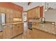 Spacious kitchen with tile backsplash, stainless steel appliances, and granite countertops at 9428 Bandera Ln, Port Charlotte, FL 33981