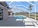 A screened-in pool area with scenic views and ample sunshine at 9428 Bandera Ln, Port Charlotte, FL 33981