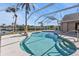 Beautiful caged pool area with a serene lake view and a pool-side statue at 9428 Bandera Ln, Port Charlotte, FL 33981