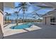 Relaxing screened pool area with a picturesque lake view at 9428 Bandera Ln, Port Charlotte, FL 33981