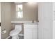 Cozy powder room with modern fixtures and convenient layout at 9428 Bandera Ln, Port Charlotte, FL 33981