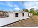 Attractive home with a paved driveway, a garage, and landscaping along the house at 9505 Delray Dr, New Port Richey, FL 34654