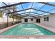 Inviting screened-in pool with clear blue water, perfect for relaxation and enjoying the outdoors at 9505 Delray Dr, New Port Richey, FL 34654