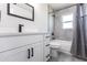 Bathroom showcasing white vanity with dark hardware, toilet, and shower with modern finishes at 11176 3Rd Ave, Punta Gorda, FL 33955